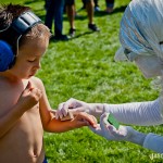 A young conertgoer hanging out with a white pixie at Bumbershoot A young conertgoer hanging out with a white pixie at Bumbershoot